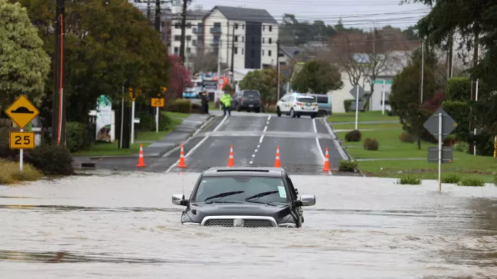 Heavy rain hits Auckland, trains suspended