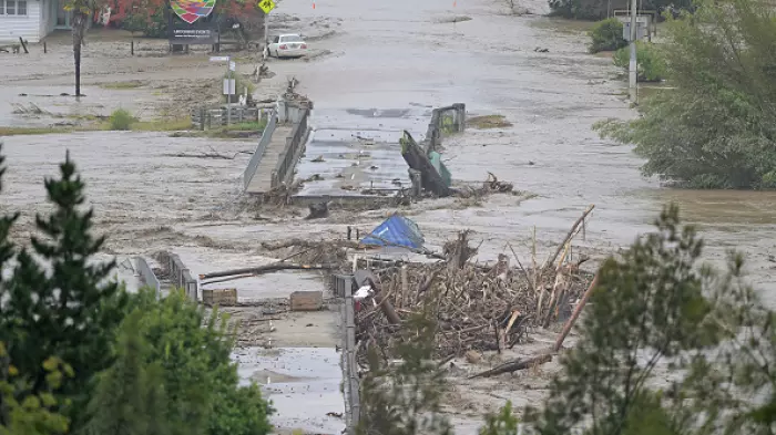Scramble to fix a flooded substation built by a river