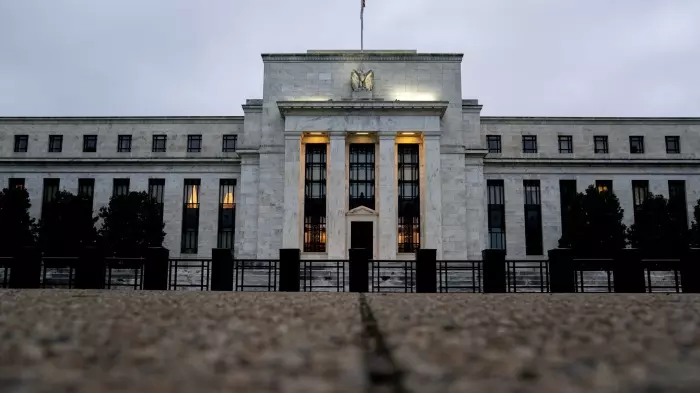 Fed hikes rates by quarter point, Powell hints at possible pause