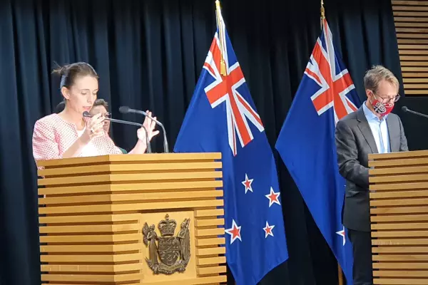NZ's moving to red as Omicron's here: 'get boosted' urges Ardern