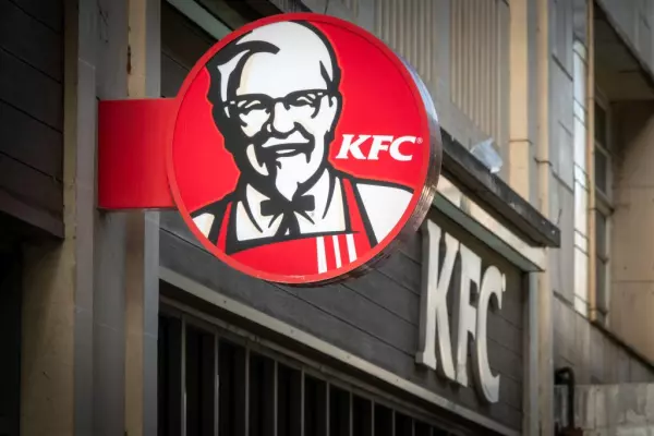 KFC operater's shares marginally down on big profit fall