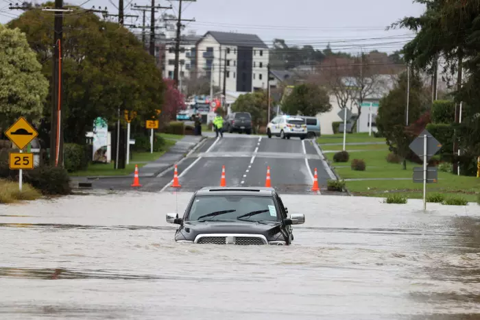 Heavy rain hits Auckland, trains suspended