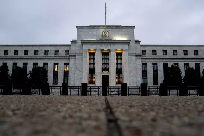 Fed hikes rates by quarter point, Powell hints at possible pause