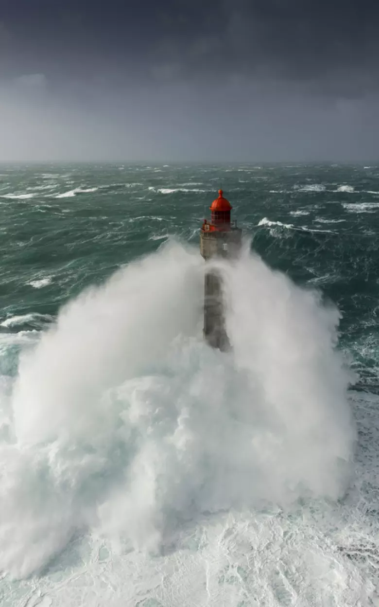 Ushant and its lighthouses are battered by ferocious storms in winter – something summer day-trippers are spared. (Image: Getty)
