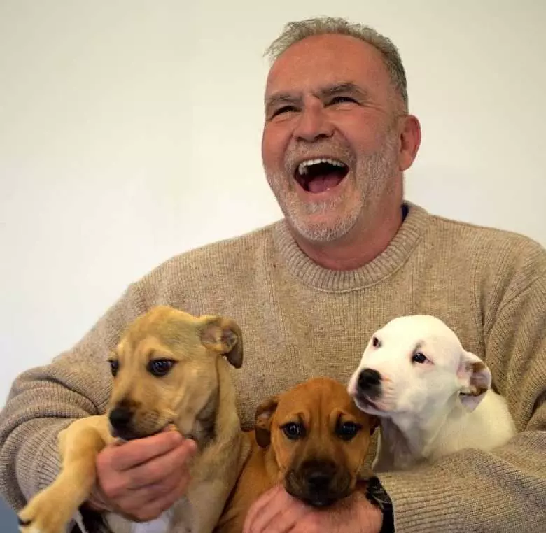 Andy Davies with some of his rescue pups. (Photo: Brenton Thornton).
